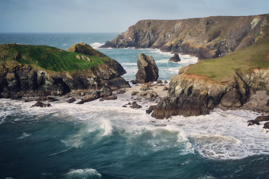 Rugged coast line and dramatic waves over Kynance cove, great to visit for October half term