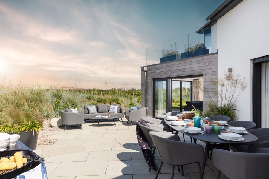 Dusky skies over outdoor dining area of Porthilly - dog friendly Cornwall holiday home from Cornish Gems